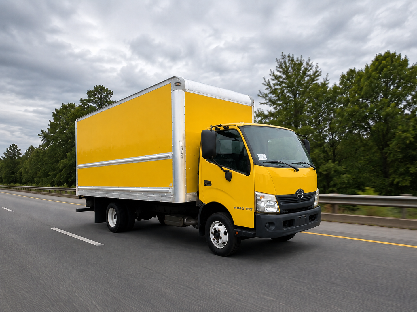 Yellow box truck on the road